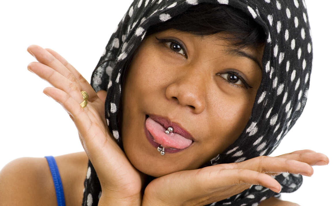 Do oral piercings and tattoos cause dental issues?