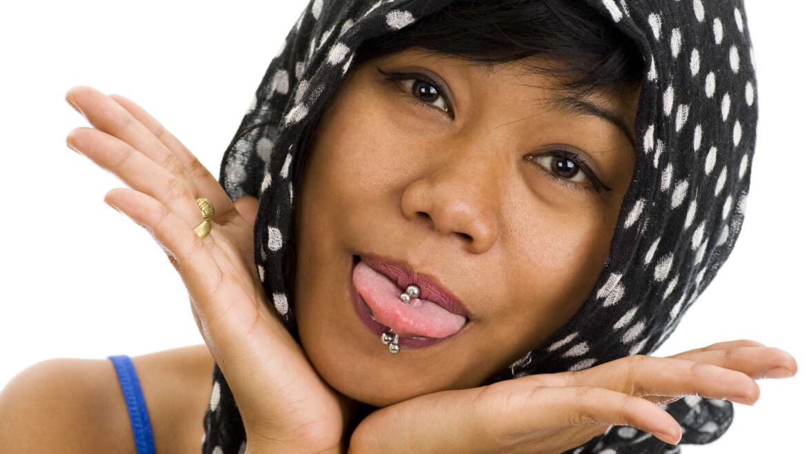 Do oral piercings and tattoos cause dental issues?