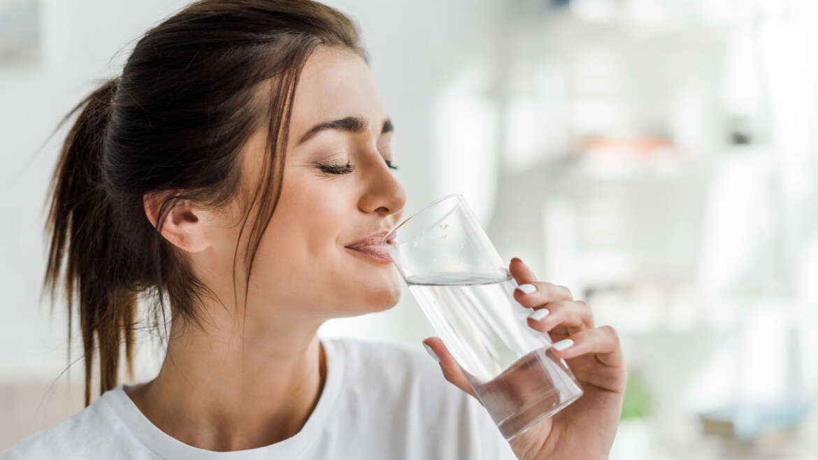 Celebrating Dental Smiles Month: How Regular Hydration Boosts Oral Health